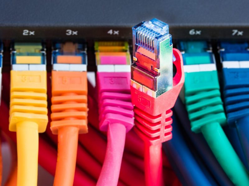 Colorful network cables connected to a switch